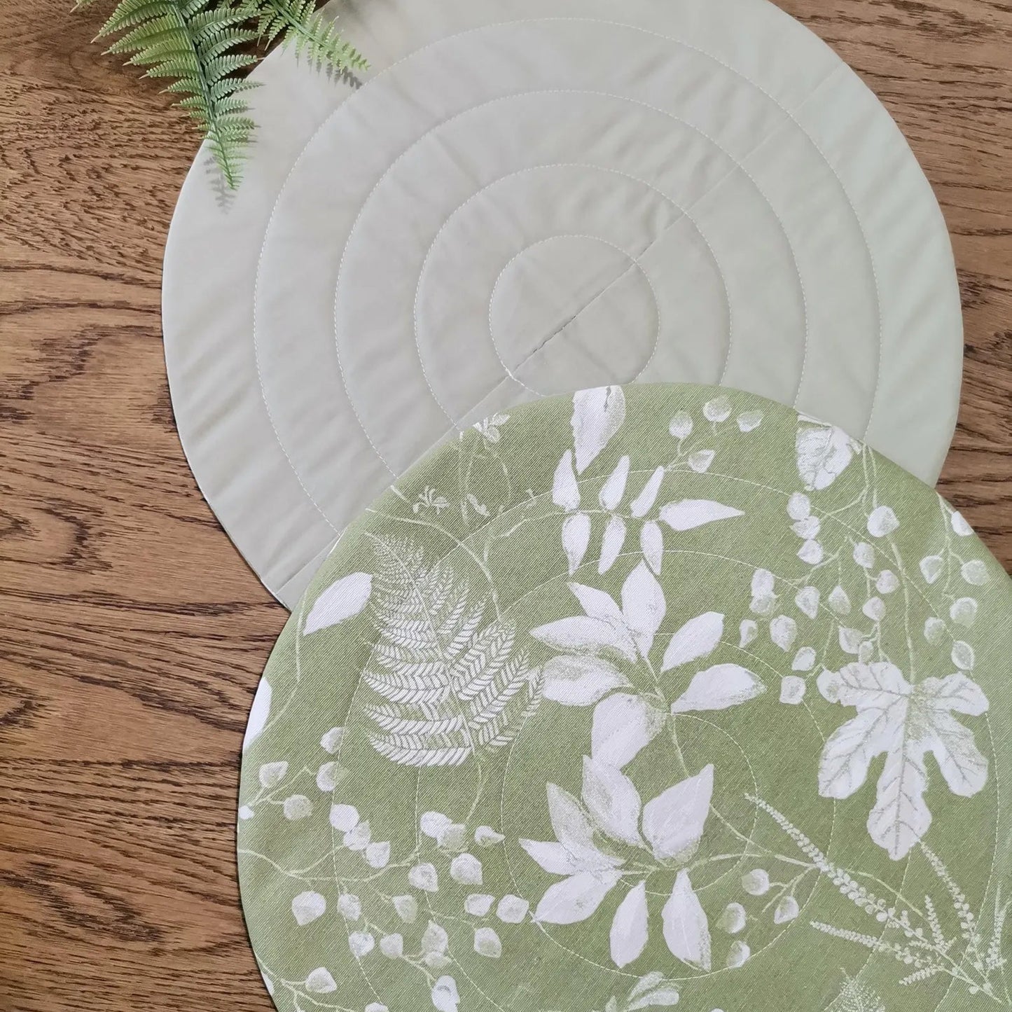 Round quilted placemats in green botanical print