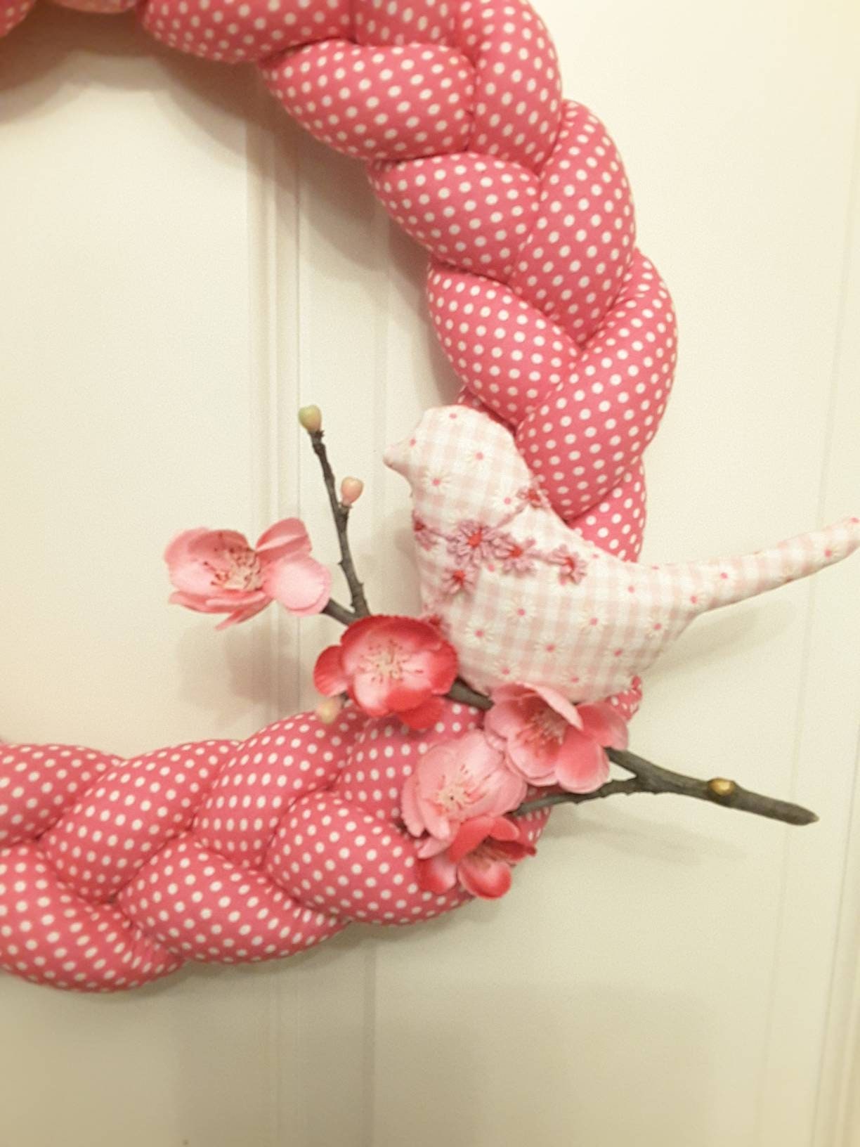 Pink Braided Fabric Wreathwith a Bird on a Cherry branch