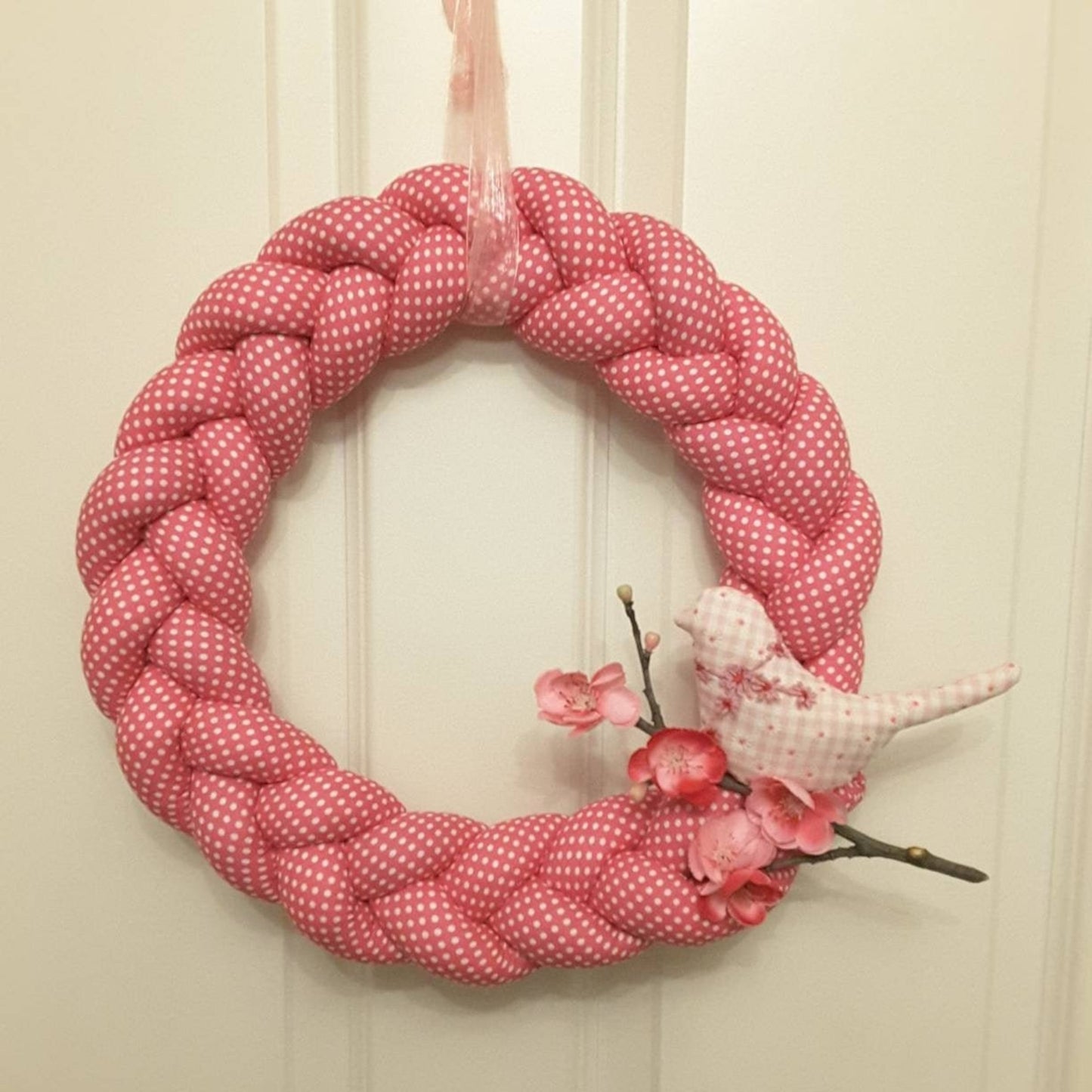 Pink Braided Fabric Wreathwith a Bird on a Cherry branch
