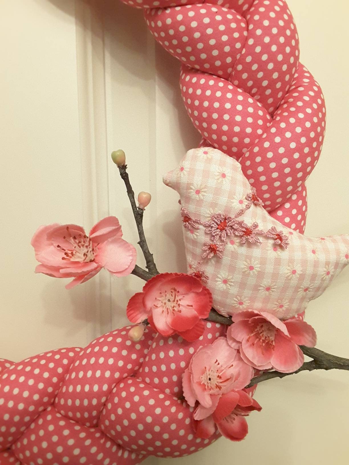 Pink Braided Fabric Wreathwith a Bird on a Cherry branch