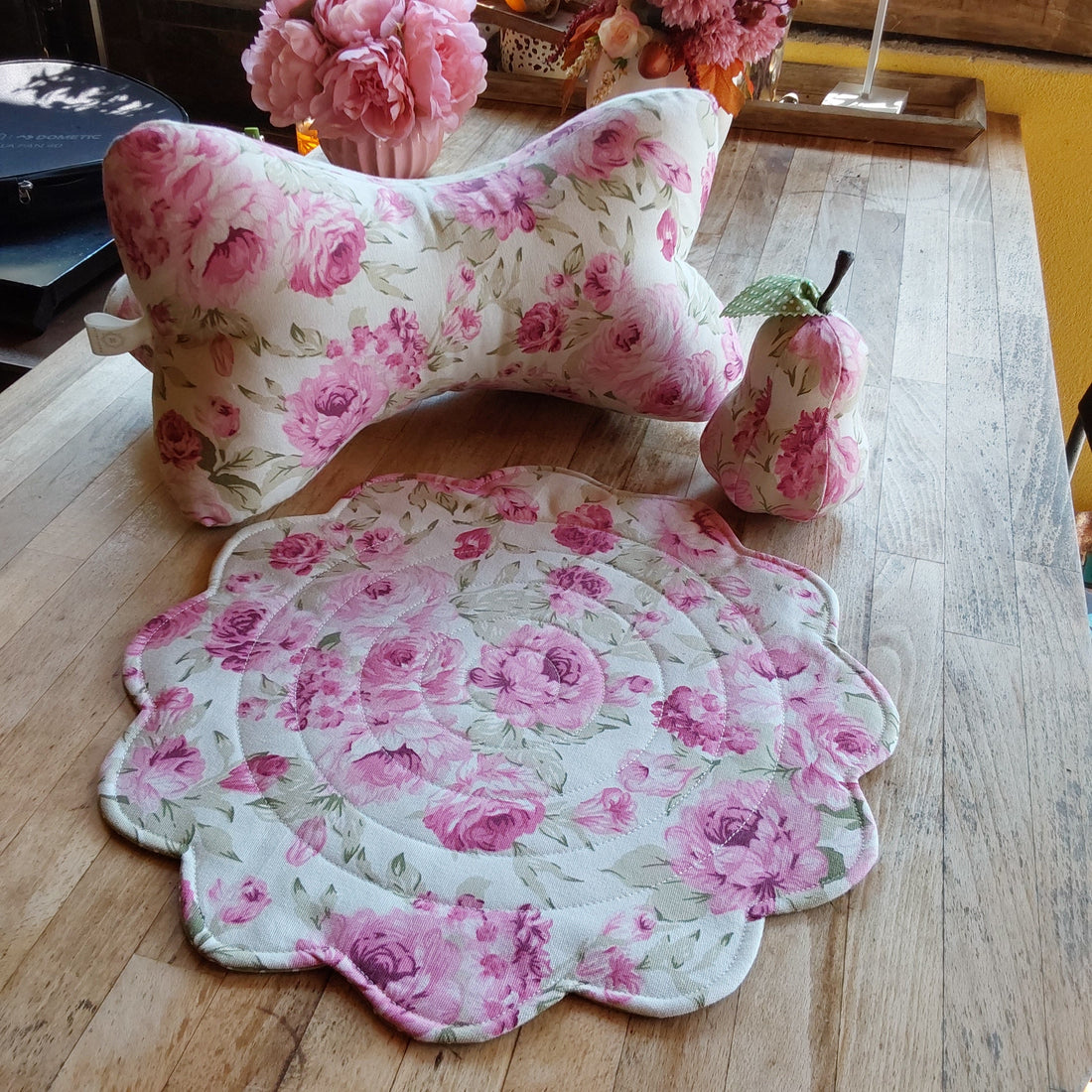 placemat, pillow and a fabric pear in romantic flower print