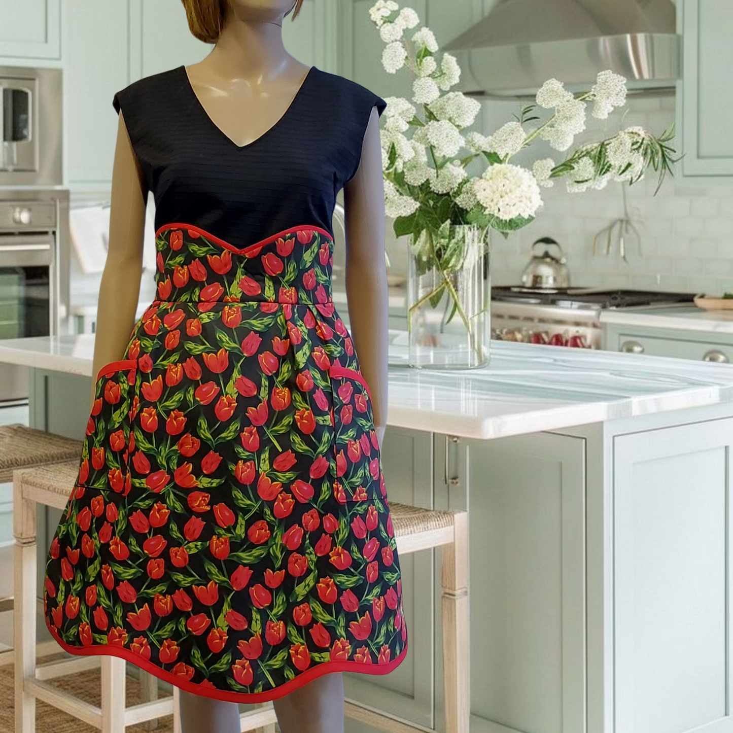 An elegant black and red tulips half apron with a high waist cut, apron Tara by Katrushka, handmade in Slovenia
