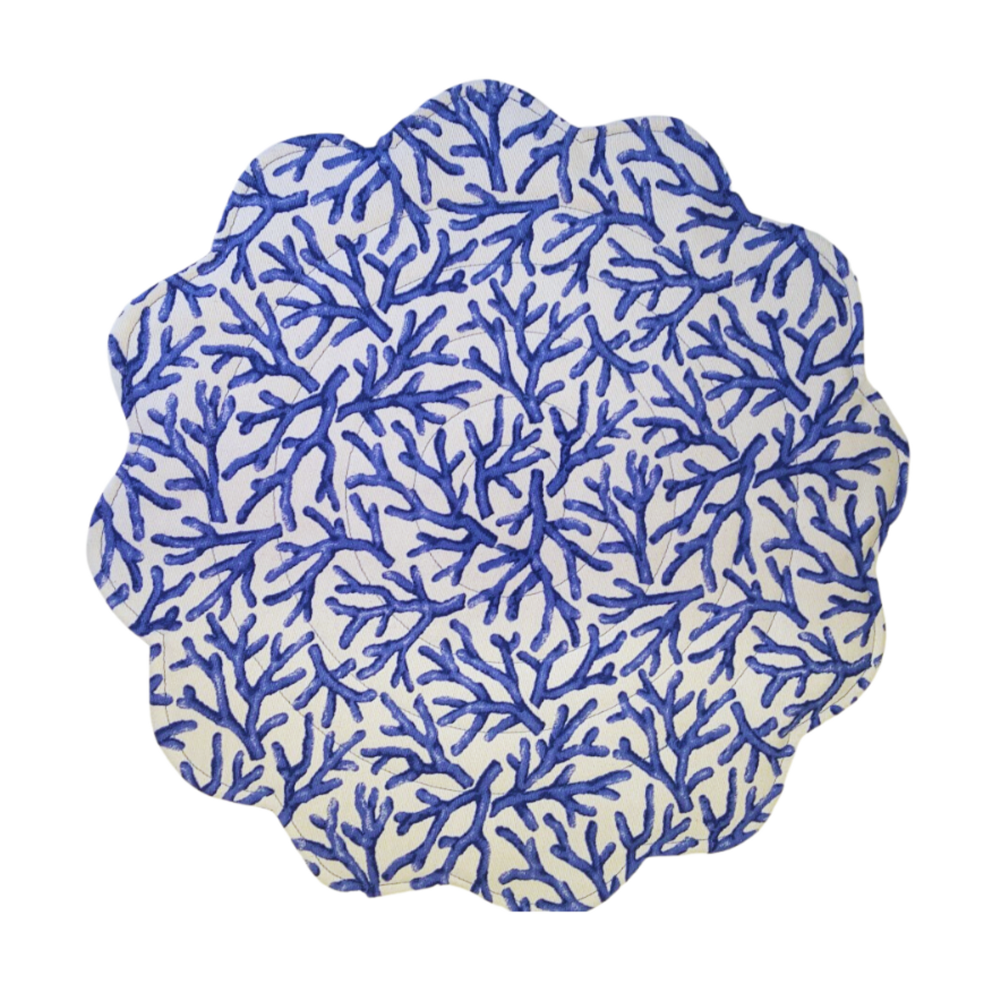 A round quilted placemat with blue and white scalloped edges featuring a coral print design on a white background.