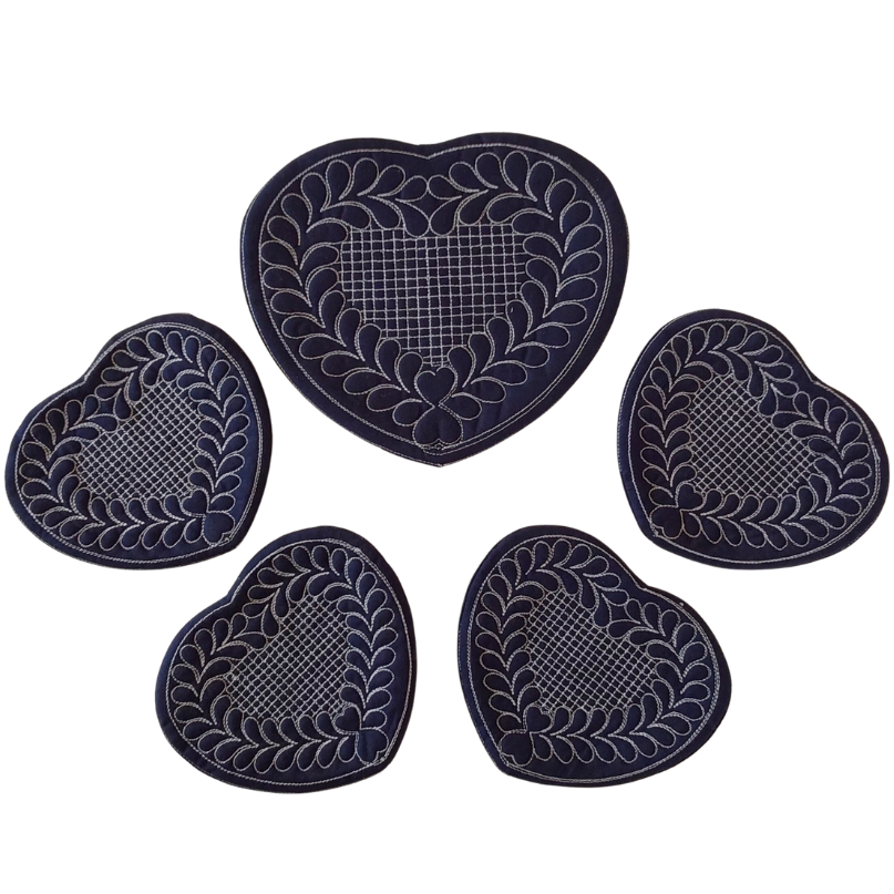 Set of five heart-shaped coasters with decorative patterns on a white background