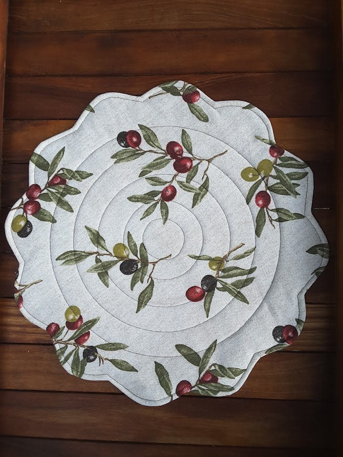 Round quilted placemat, scalloped edges olives print on beige